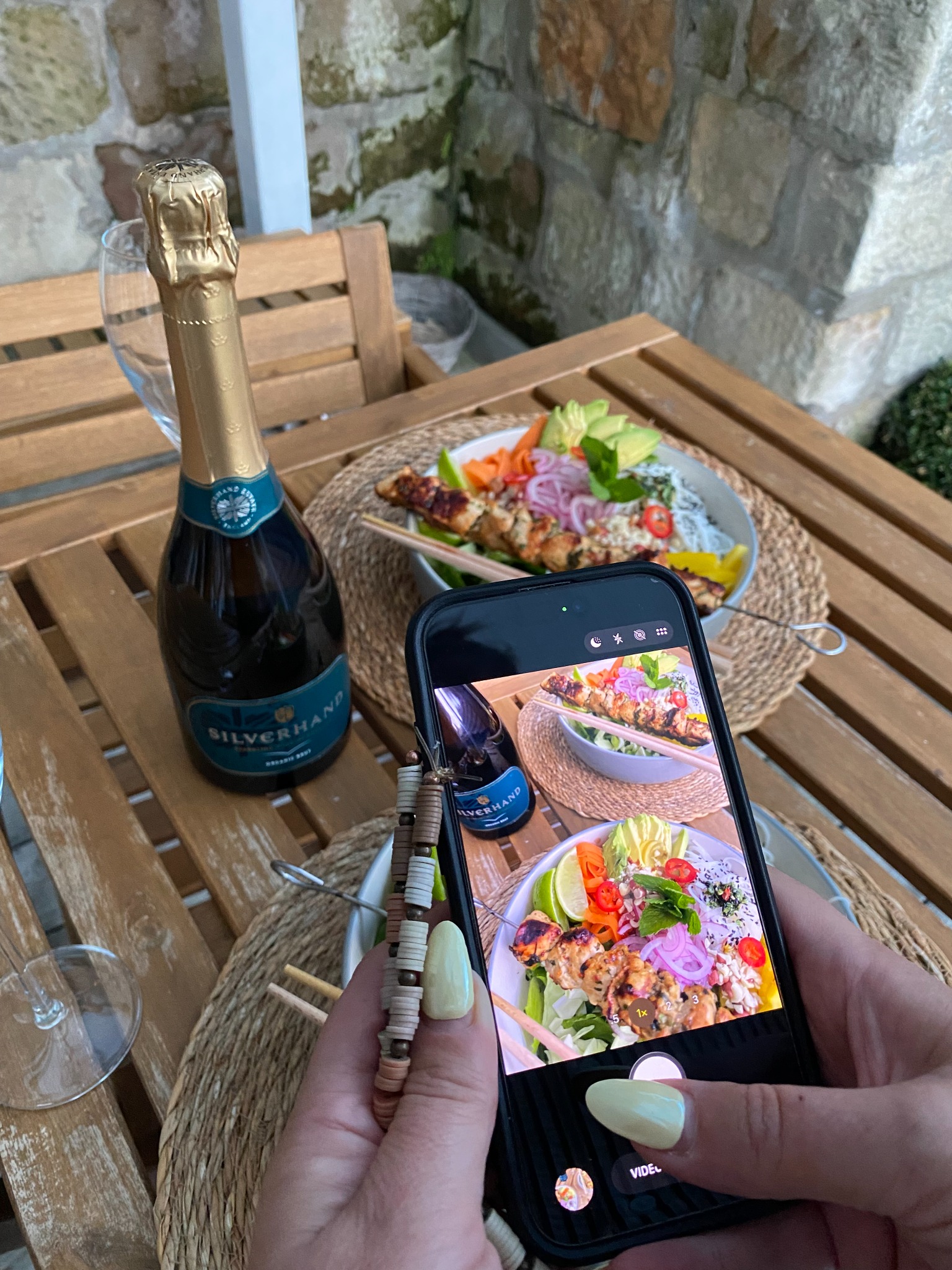 Photographing Silverhand sparkling wine beside a meal