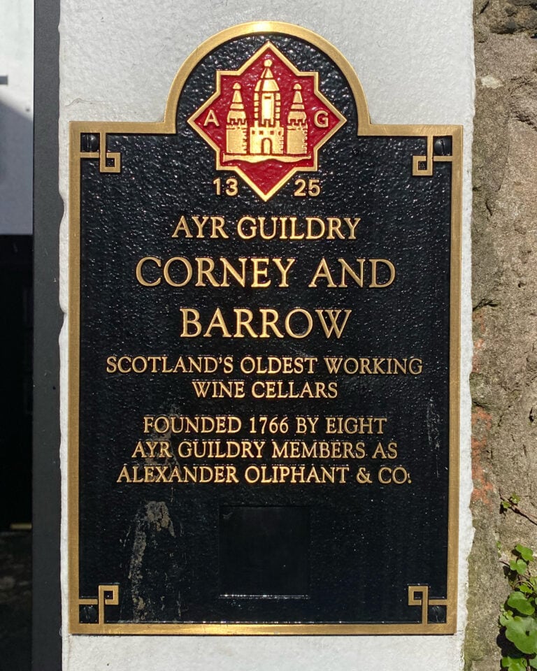 Historic Ayr Guildry plaque at Corney & Barrow, describing wine cellars founded in 1766.