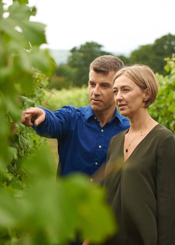 Nyetimber winemakers Brad Greatrix and Cherie Spriggs inspecting vines