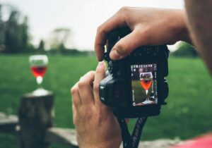 Camera viewfinder framing a glass of wine