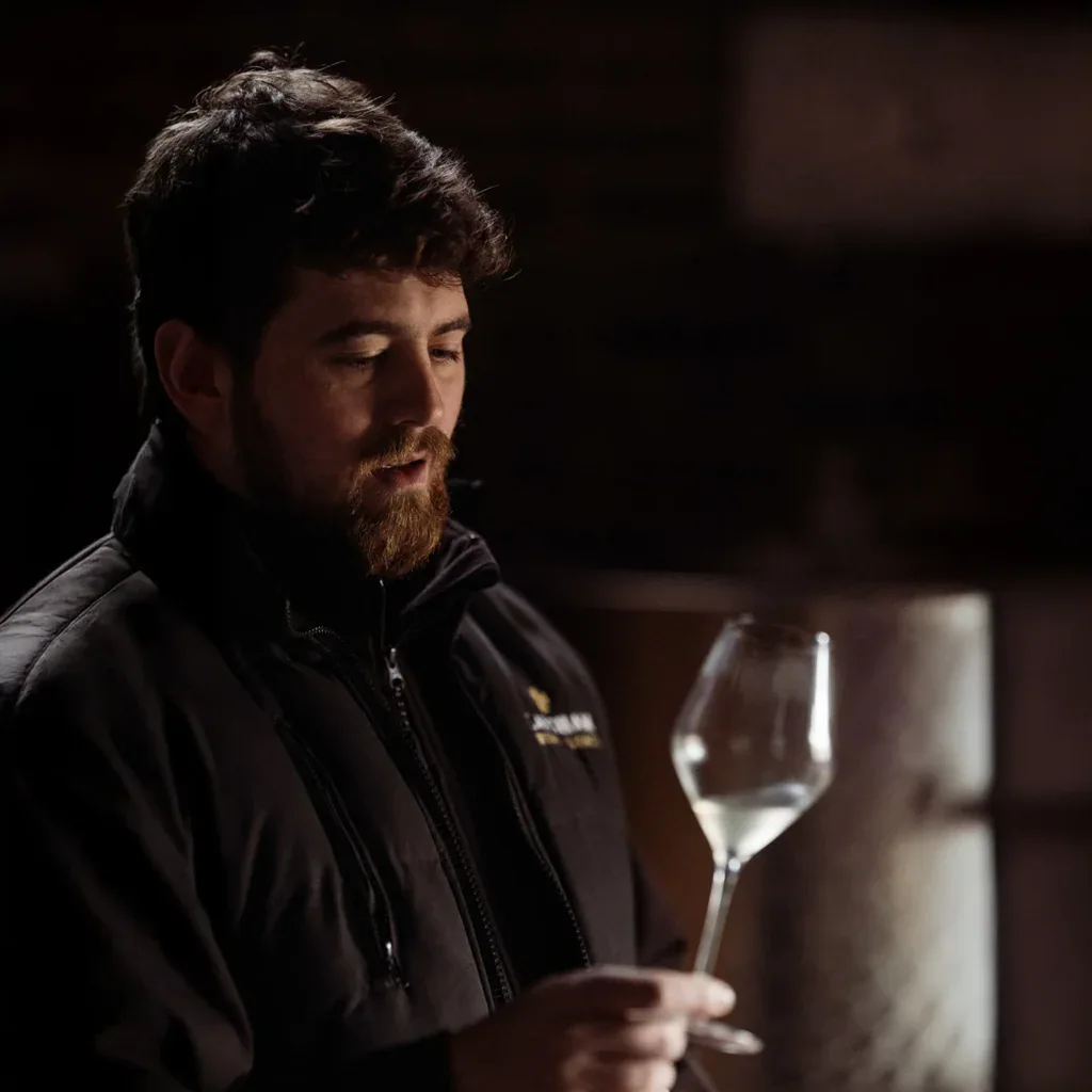 Tommy Grimshaw tasting wine — official Vyn Dene website photograph